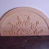 Celtic knot carved into wood transom.