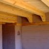 Beams over corbels with wood bond beam. 

Home by Win DeLapp